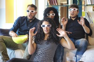 4 People Watching Tv with 3D Glasses